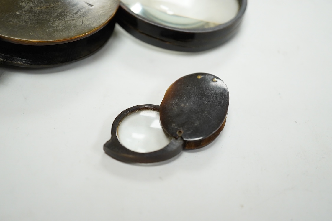A group of 19th-century horn framed loupes, quizzing glasses and four optician multiple lens sizing lorgnettes (13)